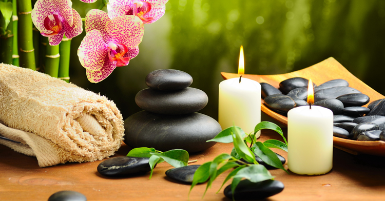 Therapist preparing aromatic massage oils