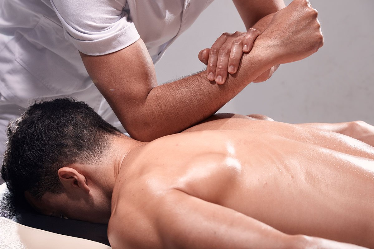 Therapist performing deep tissue massage