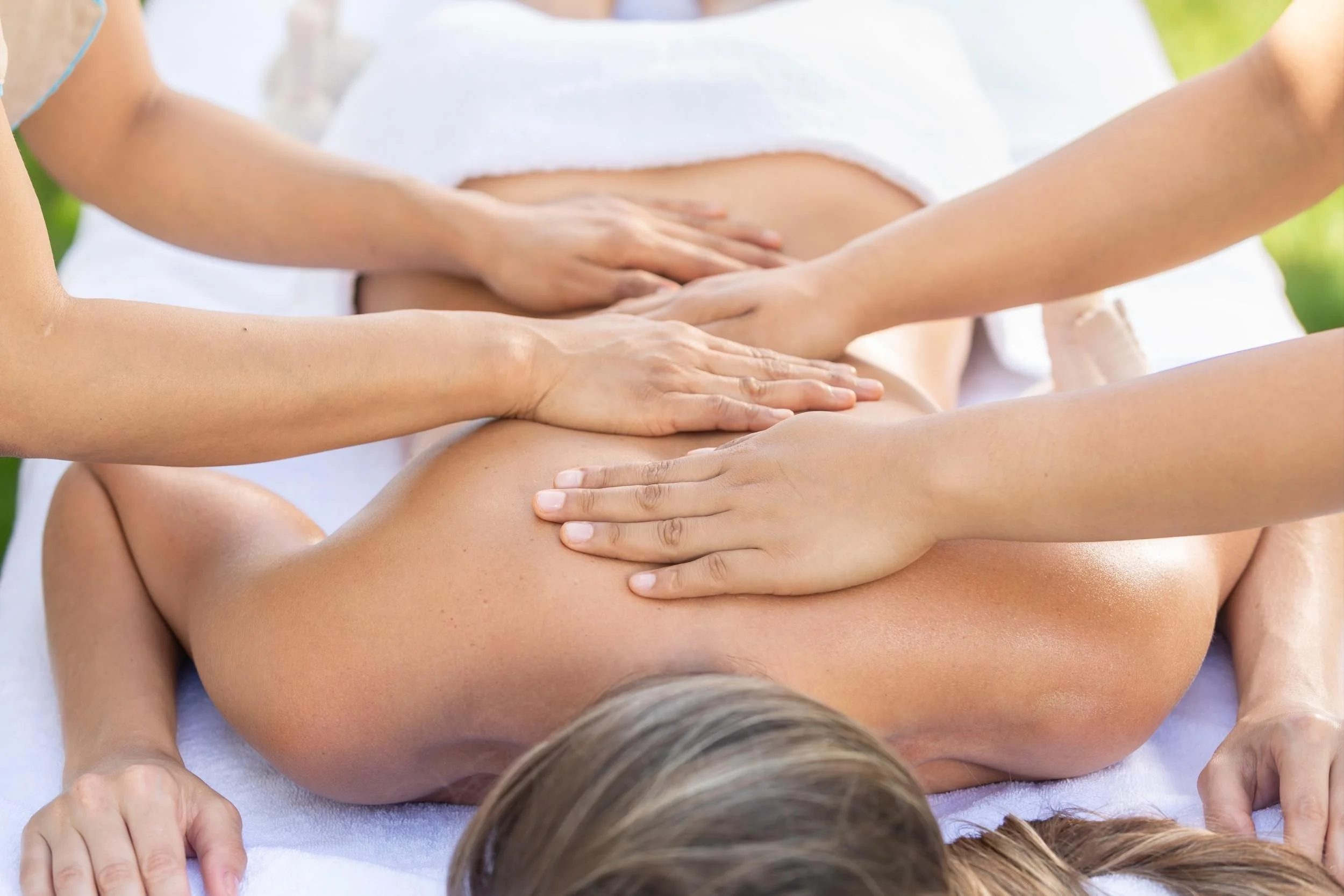Four-hand massage by two therapists